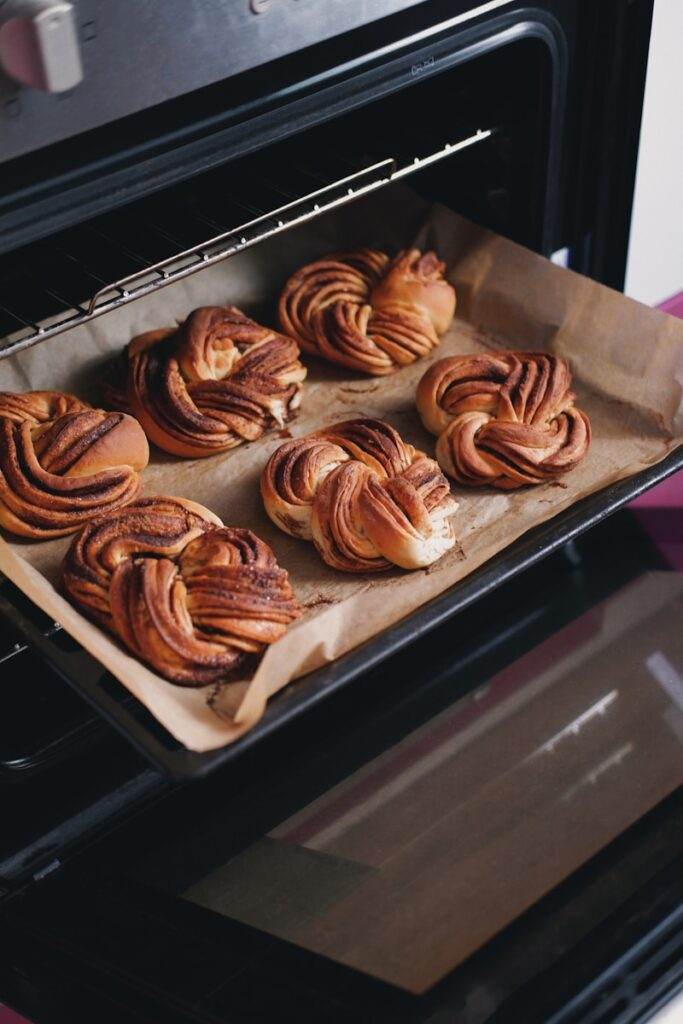 Home Bakery A Tray Of Freshly Baked Pastries In An Oven