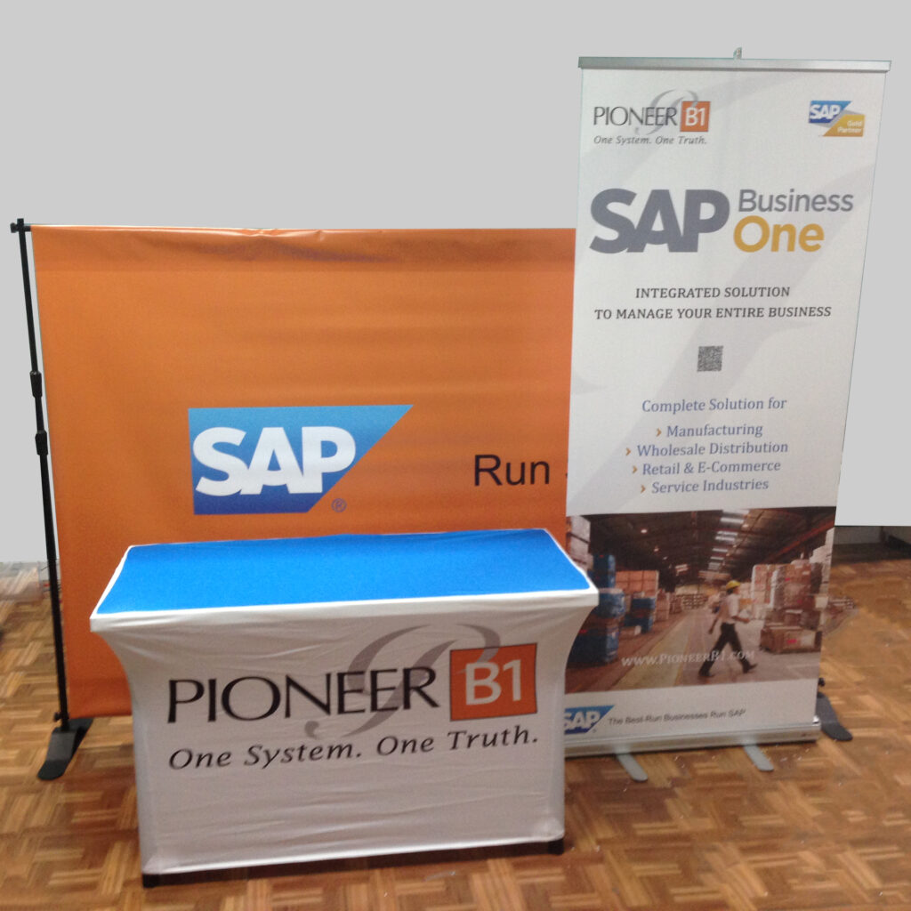 Pioneer B1 And Sap Business One Display With An Orange Backwall, Blue-Topped Counter And White Retractable Banner.