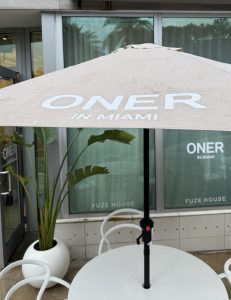 Branded Activation Printing Miami | Oner Active Swim Week Branded Storefront With Custom Window Vinyl And Logo Umbrellas For Oner Active'S Miami Event Activation