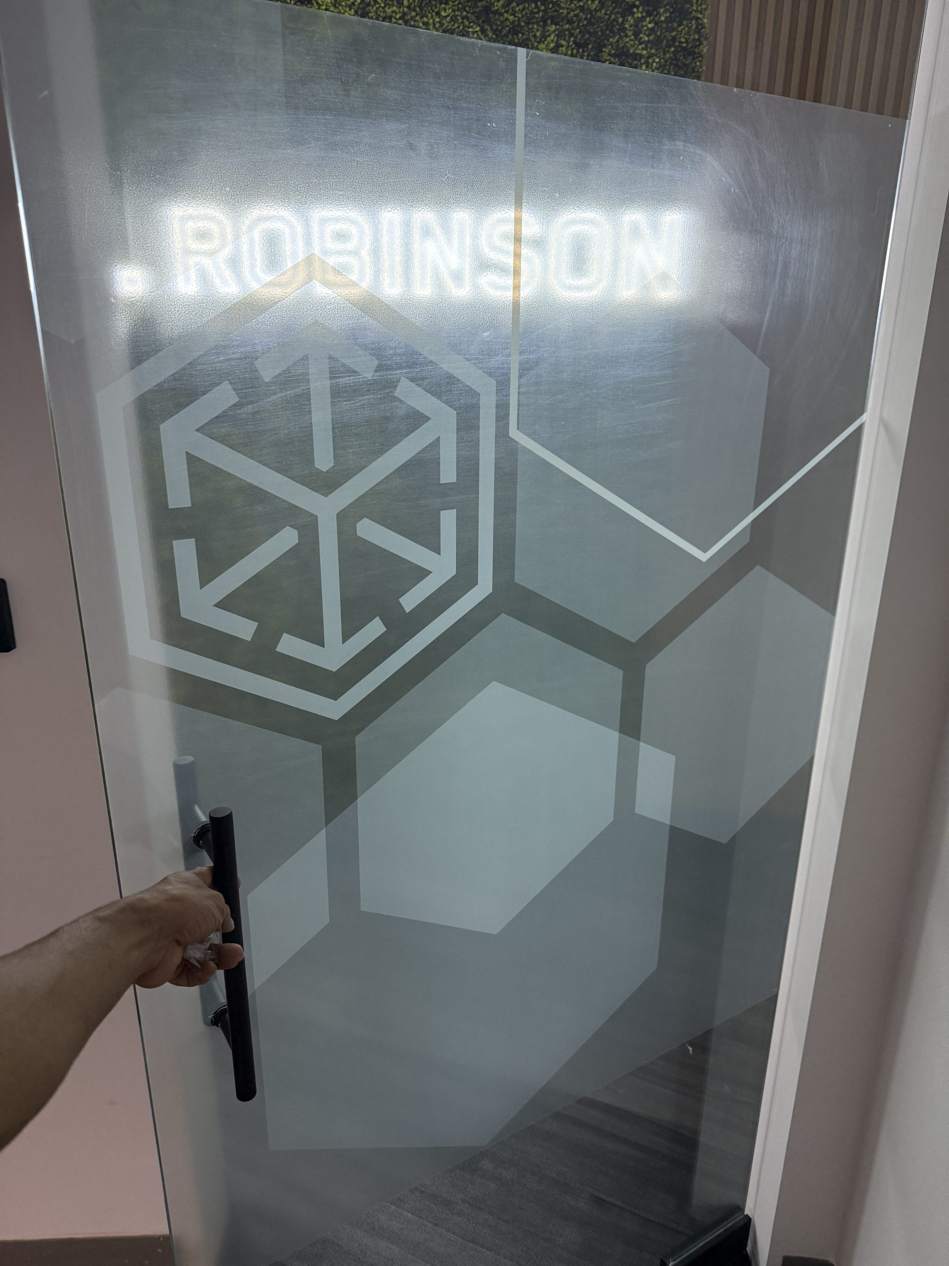 C.h. Robinson Doral Office Signage | Led Neon &Amp; Glass Graphics Close-Up Of A Printed Clear Vinyl Logo And Geometric Privacy Pattern Applied To Glass